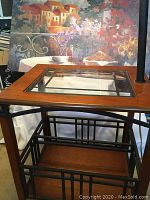 Oil painting of Mediterranean cliffside behind the table