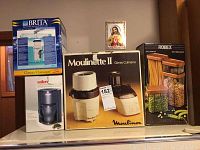 Photo showing Moulinex Moulinette II food processor box, Salton coffee maker, Brita water filter box, and Robex canisters box.