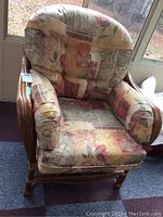 Front view of bamboo chair with padded cushions showing upholstery pattern and structure