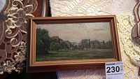 Full view of the 11x17 framed landscape painting on fabric background
