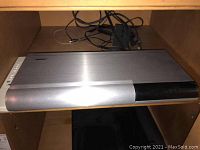 Front view of closed main unit with cables behind