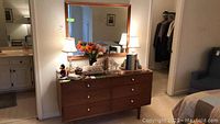 Overview of dresser and mirror with decorative items on top