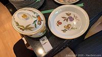 Evesham covered casserole with lid and 10.5 inch pie plate showing fruit pattern and gold detailing