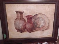 Front view of the framed oil painting showing two vases and a plate on a beige background.