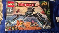 Front view of LEGO Ninjago Water Strider Set 70611 box showing set details, recommended age 8-14, 494 pieces, new with a damaged box.
