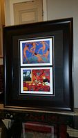Full view of the professionally framed and matted artwork showing both prints within a large black frame.