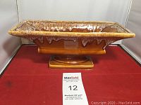 Rectangular Roseville Pottery centerpiece bowl with drip glaze on a pedestal base shown from front.