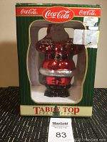 Front view of the boxed 1998 Coca Cola Mercury Glass Santa figurine with original packaging