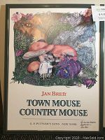 Framed poster with colorful illustration of mice under a mushroom, titled "Town Mouse Country Mouse" by Jan Brett.