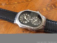 Front view showing dual black dials, silver-tone case and crystal-accented bezel