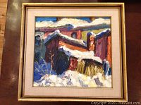Front view of framed painting depicting snow-covered houses in Cabbagetown