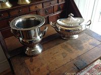 Both wine cooler and lidded tureen displayed side by side on wooden desk