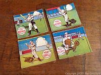 Overview of four cards displayed on wood surface showing Bill Dickey, Joe Medwick, Dolph Camilli and Hank Greenberg cards