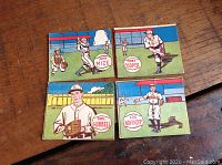 Four baseball cards laid out in two rows