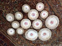 Overhead view of full lot arranged on patterned rug