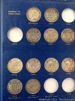 Page showing George VI half dollars with empty slots for missing variants