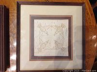 Front view of first framed birch bark biting showing four birds in a square arrangement