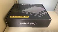 Retail box labeled Mini PC, “Small, Fast, Quiet”
