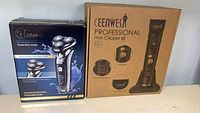 Boxes of Hatteker RSCX9598A shaver and CEENWES CWS 011 hair clippers showing brand names and models.