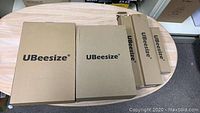 Boxes from UBeesize showing brand and quantity of items