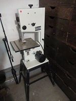 Full front view of band saw on stand