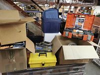 General overview showing storage bins, cardboard boxes and yellow toolbox
