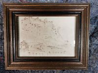 Front view of framed drawing showing sketch and frame