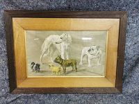Frontal view of entire oak-framed print showing wood moulding and image of six dogs