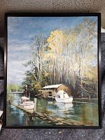 Frontal view of full framed painting showing river scene with boats, boathouse, trees.