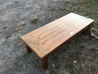 View of the rectangular pine wood coffee table showing wood grain and natural finish