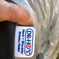 Close-up photo of Dr Ho's brand label on the neck and shoulder massager