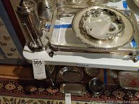 Overall view of chocolate pot standing on large serving tray with serving dish on tray