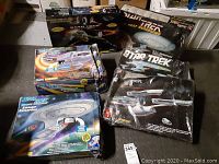 Six Star Trek spaceship model boxes and packaging arranged in a group, showing overall lot contents