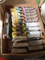 Box with multiple Star Trek The Next Generation action figures in original packaging.