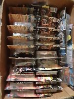 Box filled with various new Star Trek Generations action figures in original packaging.