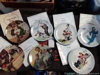 Photo shows eight Norman Rockwell collector plates with various illustrations including Valentine’s Day, Batter Up, Gone Fishin, and a certificate of authenticity.
