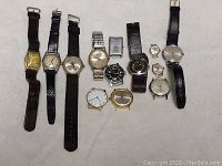 Overview of 12 assorted vintage mechanical wristwatches with leather and metal bands, varying dial shapes and colors.