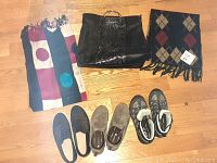 Photo showing two scarves, one black handbag, and four pairs of shoes (two WindRiver women's shoes and two others)