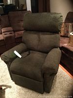 Front view of chair upright with remote on seat