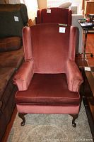 Front view of wing back chair showing upholstery and shape