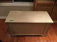 Overview of the solid wood blanket box showing the rectangular shape and white wash finish.