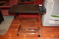 Full front view of the overbed table showing tabletop and base