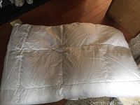 White feather duvet, quilted and fluffy in appearance