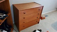 Full front view of dresser showing four drawers and handles