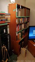 Full view of teak buffet with removable bookcase top, books on shelves visible