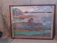 Framed colorful horse artwork poster signed by Helga Roberts, depicts a horse with detailed design against a scenic background with sun and hills.