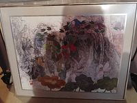 Photo showing framed oriental fish pond artwork with multiple fish and aquatic plants in a muted, pastel color palette.