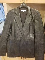 Front view of the black leather blazer showing button closure, lapel collar, and pockets