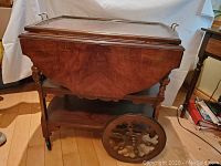 Full view of wooden tea trolley with drop leaves folded down