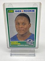 Front of 1989 Score #257 Barry Sanders rookie card in plastic sleeve